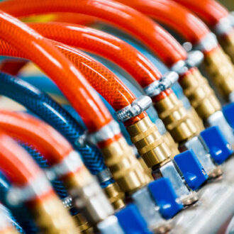 cooling system equipment in the factory, hoses and cocks. Complex equipment